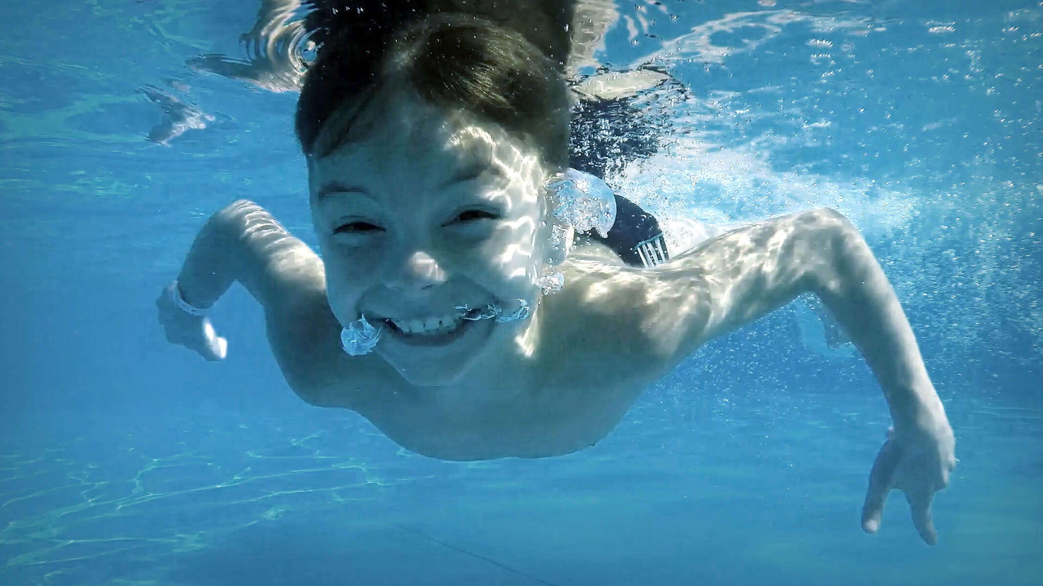 Tom swimming