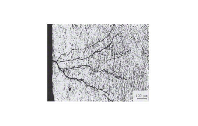 Fig. 11 Corrosion: Corrosion cracks caused by transgranular stress corrosion (micrograph)