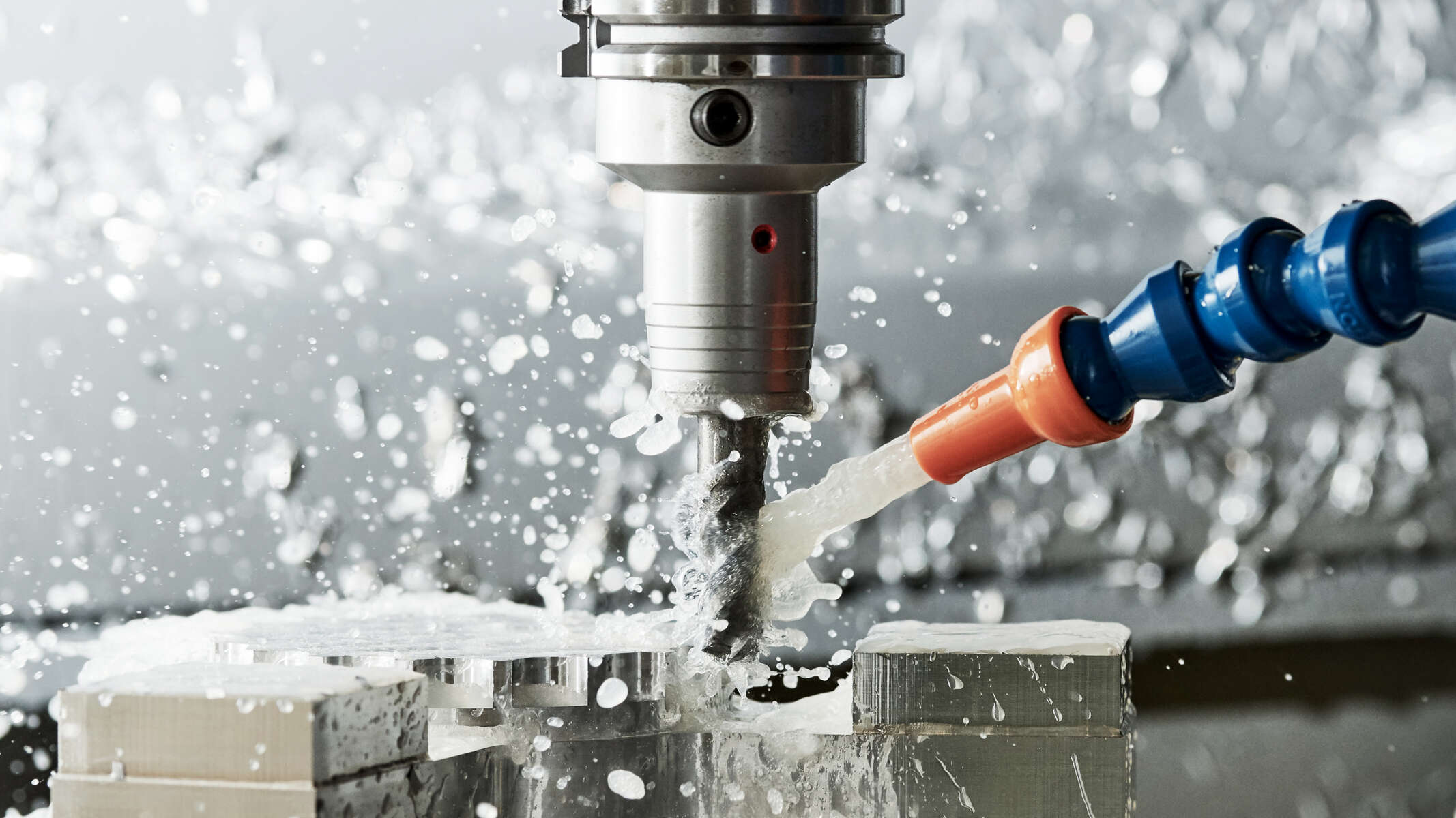 In demand in mechanical engineering: pumps help to remove metal chips and separate them from cooling lubricants. Mechanical engineering: a drill milling its way through metal Chips are flushed away with water.