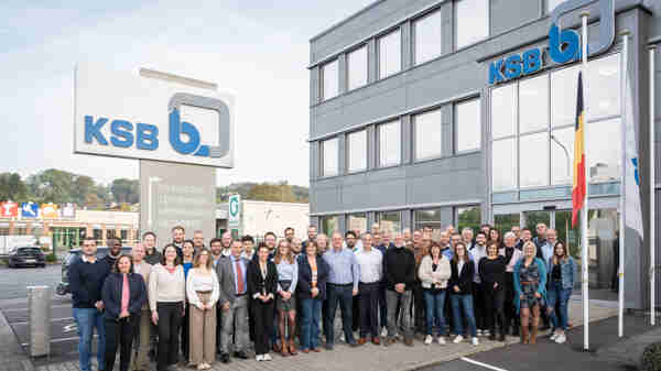 Four colleagues having a discussion in the office