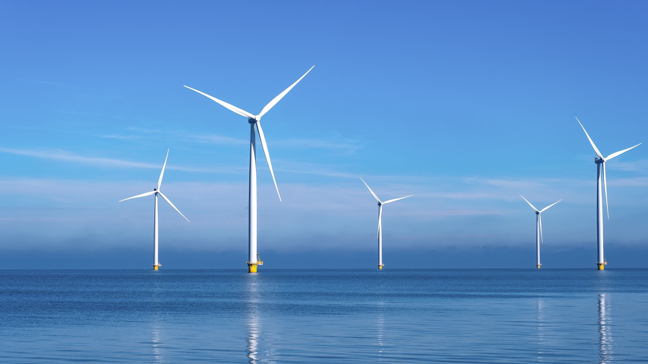 Wind turbines rotating at sea