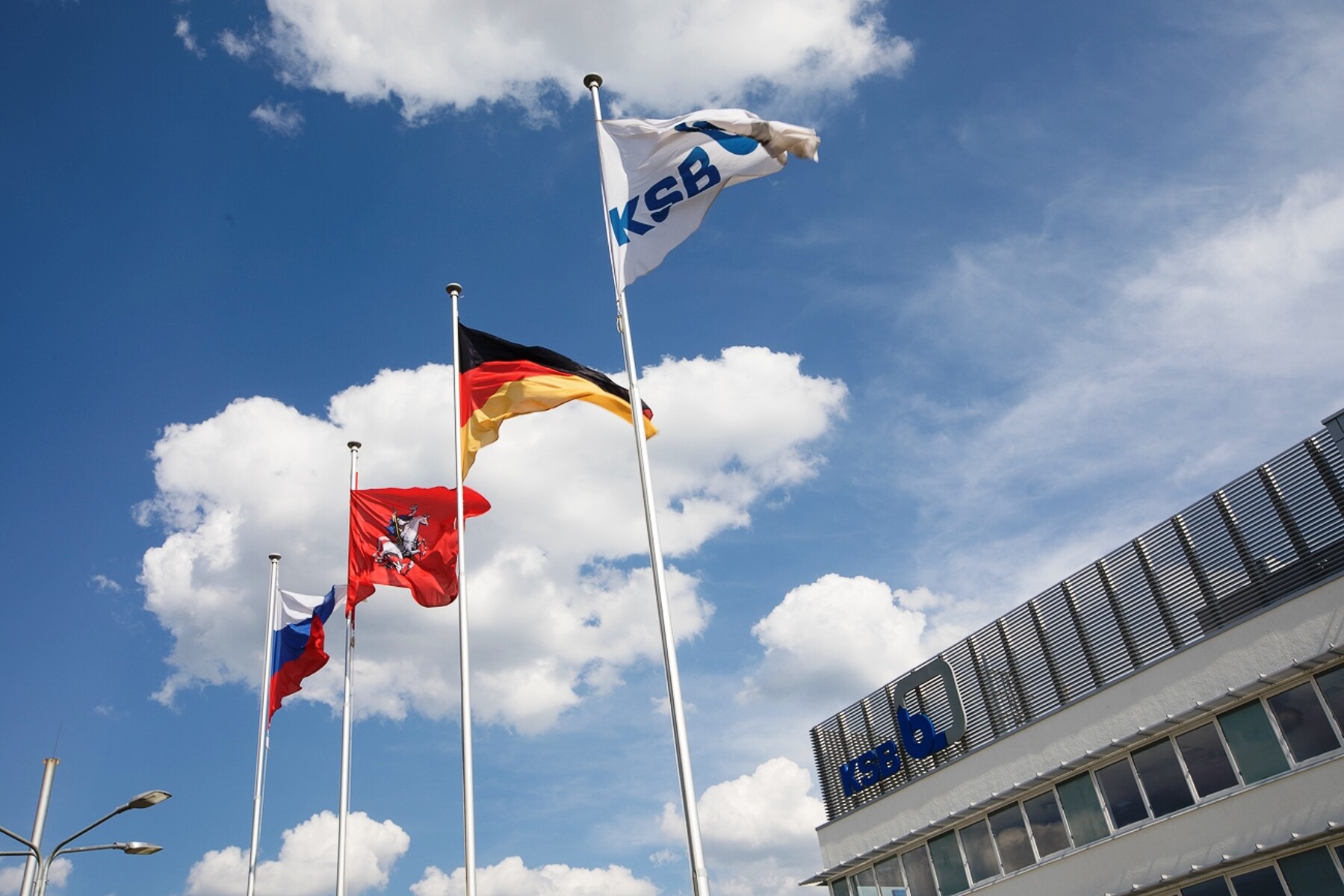 KSB flags in front of blue sky