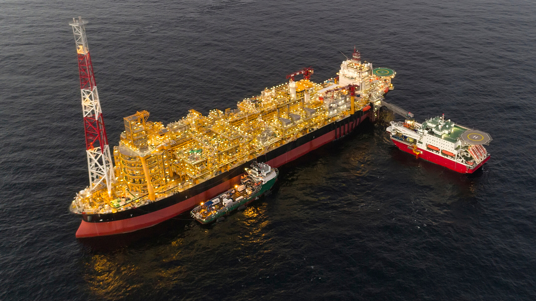 Floating vessel for hydrocarbon processing and storage near an offshore oil field