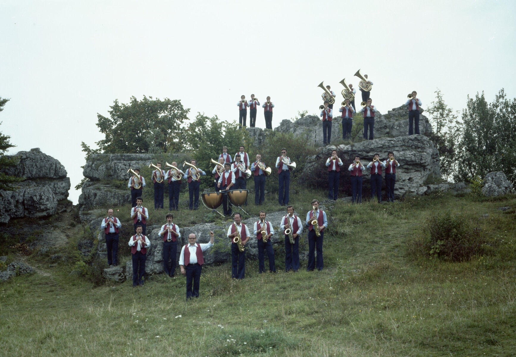The musicians of the KSB factory brass ensemble on a rock formation just off the Nuremberg-Bayreuth motorway in 1979.