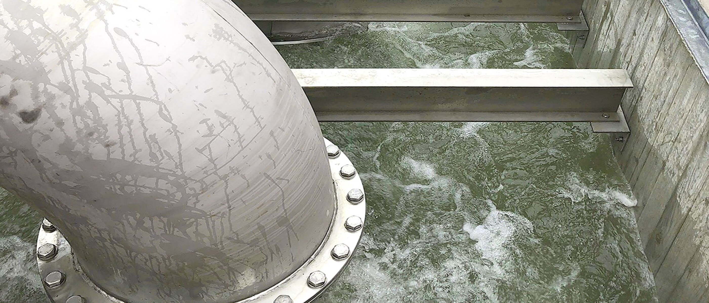 View into water drainage basin, bubbling rainwater