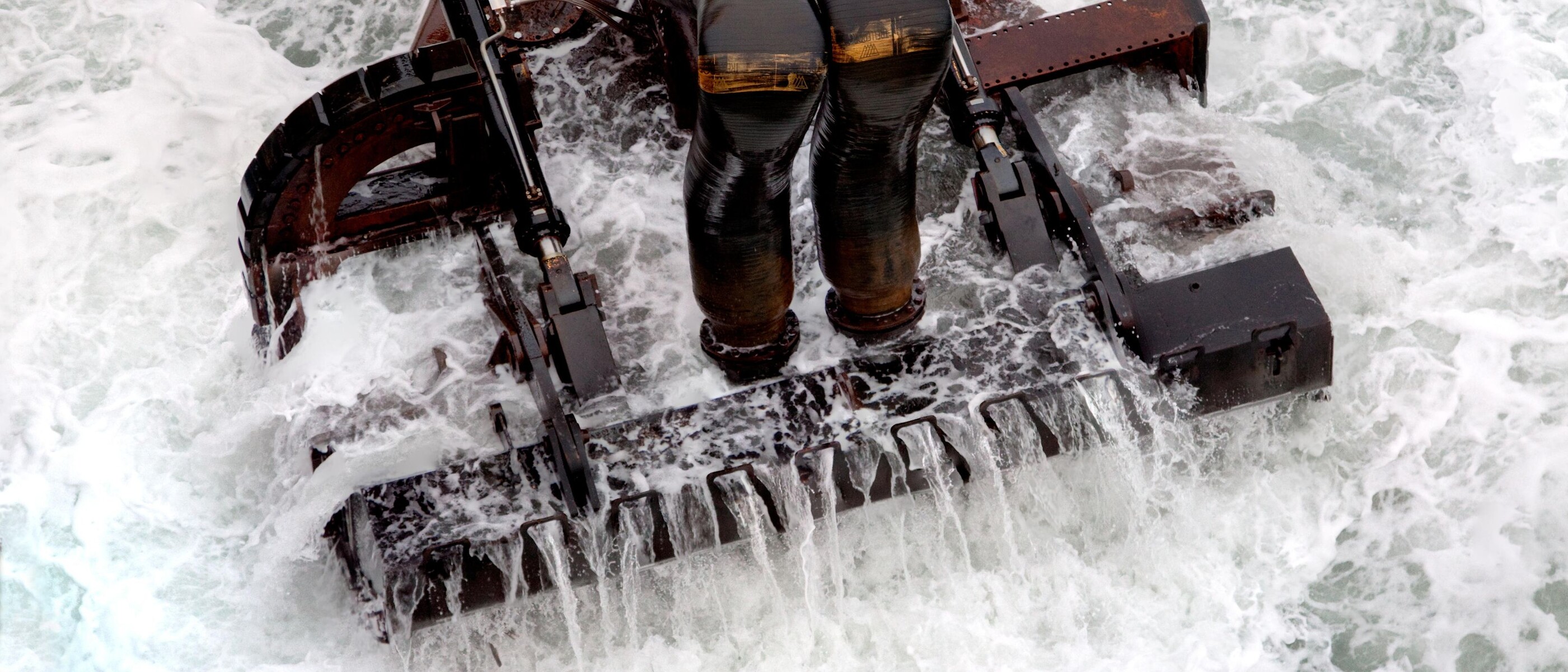 Dredging bucket in use in the ocean